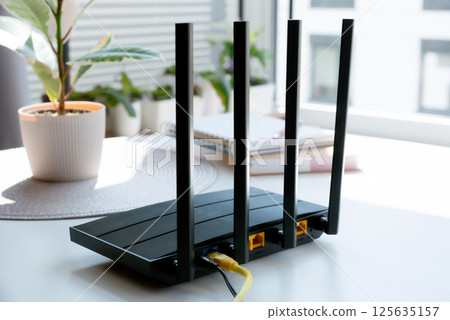 Router with 4 antennas in living room Router with 4 antennas in living room 125635157