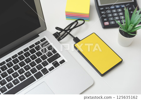 External hard disk connected to laptop. 125635162