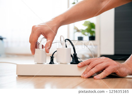 Electrical plug in outlet socket at home 125635165