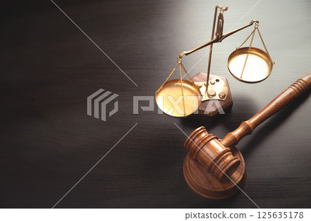 Weight scale and wooden gavel in background 125635178