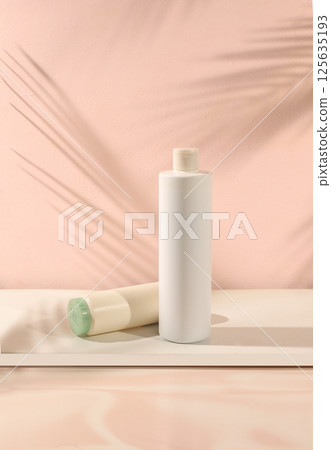 Abstract background with natural wooden podiums and long shadows on a pink wall, an empty showcase for cosmetic products demonstration or presentation, minimal ecology concept, selective focus 125635193
