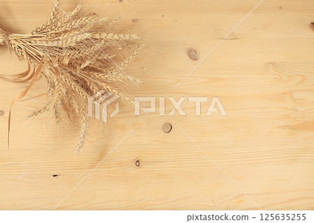 Minimal abstract background for cosmetic products presentation.Empty premium podium with shadows of tropical palm leaves on beige wall,template for design,pedistal display podium,selective focus 125635255