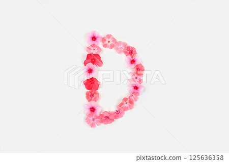 A letter D made from real fresh flowers. Creative floral font concept. Unique collection of letters and numbers for design. Spring, summer, autumn and valentines, creative idea, 125636358