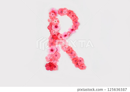 A letter R made from real fresh flowers. Creative floral font concept. Unique collection of letters and numbers for design. Spring, summer, autumn and valentines, creative idea, selective focus A letter R made from real fresh flowers. Creative floral font concept. Unique collection of letters and numbers for design. Spring, summer, autumn and valentines, creative idea, selective focus 125636387