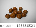 rattan seeds on white background. 125636521