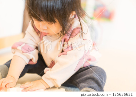 Japanese girls playing in the kids room Japanese girls playing in the kids room 125636631