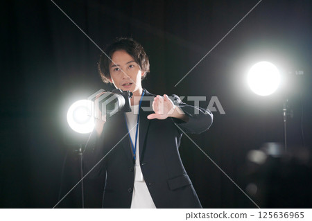 Male photographer taking a photo 125636965