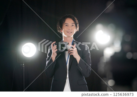 Male photographer taking a photo Male photographer taking a photo 125636973