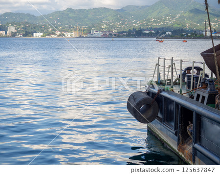 Rubber protecting the pier. Navigation safety concept. Shock-absorbing element Rubber protecting the pier. Navigation safety concept. Shock-absorbing element 125637847