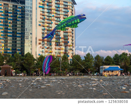 Kite Festival. Kites in the sky. A spectacle . Wind is like a force. air objects. Various forms. A beautiful sight. Aerodynamics. Object in the sky. Holiday on the beach Kite Festival. Kites in the sky. A spectacle . Wind is like a force. air objects. Various forms. A beautiful sight. Aerodynamics. Object in the sky. Holiday on the beach 125638038