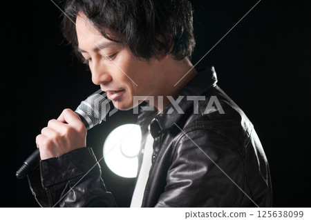 Musician singing a song Musician singing a song 125638099