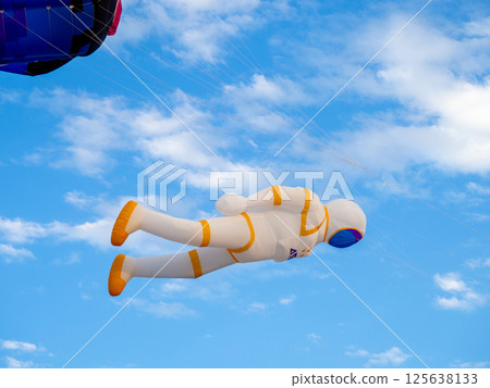Kite Festival. Kites in the sky. A spectacle in the sky. Wind is like a force. air objects. Various forms. A beautiful sight. astronaut, Kite Festival. Kites in the sky. A spectacle in the sky. Wind is like a force. air objects. Various forms. A beautiful sight. astronaut, 125638133