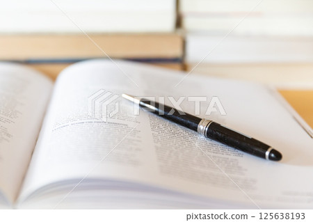 English books and pens opened on the desk Image of research and learning 125638193