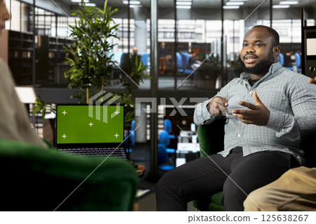 Isolated screen laptop used by coworkers preparing for business meeting, having discussion. Chroma key notebook used by teamworking employees doing research analysis for startup organization 125638267