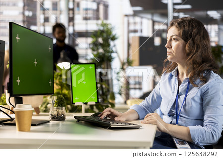 Female advisor conducting financial planning and goal setting with a mockup, demonstrating expertise in budget management. CEO analyzing online reports and forecasts for company growth. 125638292