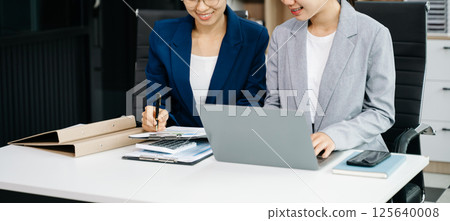 Portrait of success business people working together in office. Couple teamwork startup concept 125640008
