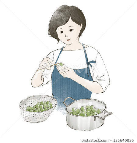 A woman removing the stems from plums A woman removing the stems from plums 125640056