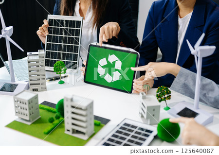 Business team people planning hand using laptop for working technology and business Net zero and carbon neutral concept.NET ZERO icons and symbols save the eco world 125640087