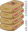 Stacked bags of stockpiled rice 125640221