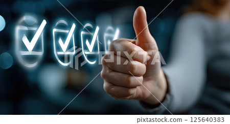 Hand giving thumbs up with digital check marks, approval and satisfaction concept, positive Hand giving thumbs up with digital check marks, approval and satisfaction concept, positive 125640383