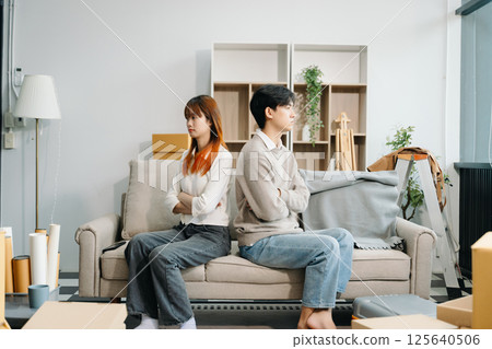 Divorce. Asian couples are desperate and disappointed after marriage. Husband and wife are sad, upset and frustrated after quarrels. 125640506