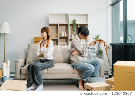 Divorce. Asian couples are desperate and disappointed after marriage. Husband and wife are sad, upset and frustrated after quarrels. 125640507