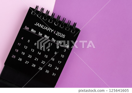 January black desk calendar for 2026 year on purple background. 125641605