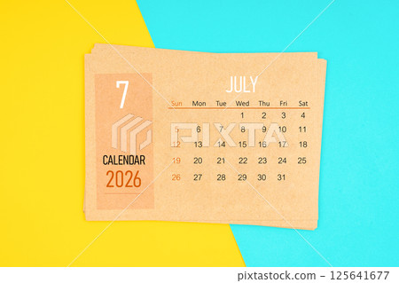 Brown calendar card for July 2026 year on yellow and blue background. Brown calendar card for July 2026 year on yellow and blue background. 125641677