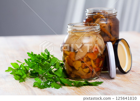Assorted marinated mushrooms in glass jar Assorted marinated mushrooms in glass jar 125641810