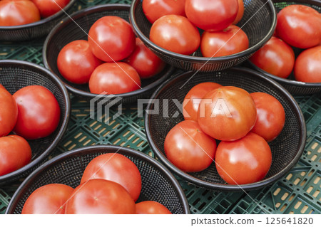 Greengrocer's basket of tomatoes Greengrocer's basket of tomatoes 125641820