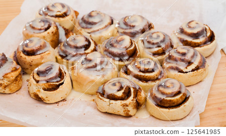 Freshly baked cinnabon buns Freshly baked cinnabon buns 125641985