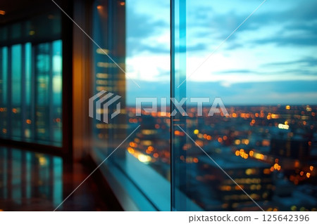 Stunning Panoramic View of High-Rise Office Interior with Blurred Cityscape at Dusk Stunning Panoramic View of High-Rise Office Interior with Blurred Cityscape at Dusk 125642396