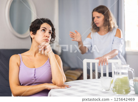 Young female LGBT couple arguing at home Young female LGBT couple arguing at home 125642469