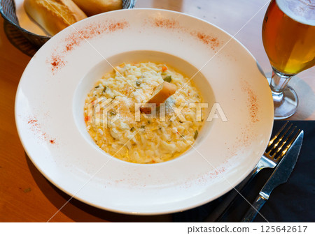 Risotto with chicken, vegetables and parmesan 125642617