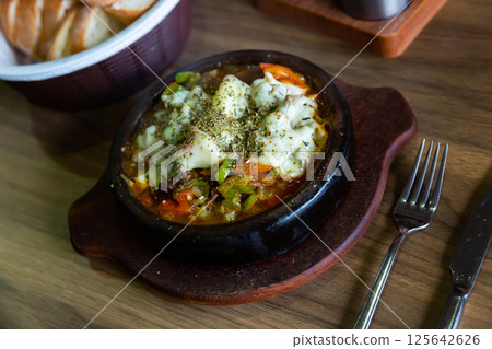 Delicious traditional dish cooked in a pot, which is called Saute in Turkish (Et Sote). Delicious traditional dish cooked in a pot, which is called Saute in Turkish (Et Sote). 125642626