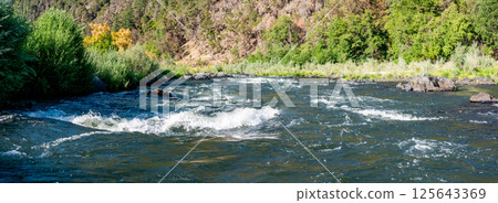 defocused Water level view of Hellgate Canyon on the wild and scenic Rogue River  125643369