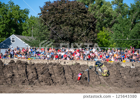 dirt embankment at a demolition derby with defocus crowd of onlookers dirt embankment at a demolition derby with defocus crowd of onlookers 125643380