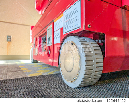 Selective focus on the front wheel of a scissor lift Selective focus on the front wheel of a scissor lift 125643422