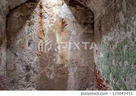 Chipped and peeling lead based paint on an old wall. Chipped and peeling lead based paint on an old wall. 125643451