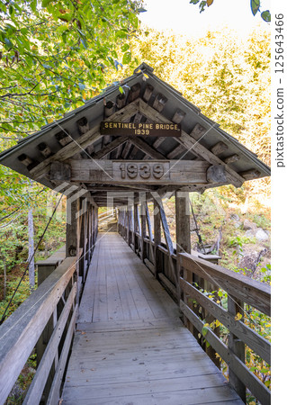 Sentinel Pine Covered Bridge in New Hampshire's Franconia Notch State Park spanning the Flume Gorge and the Pemigewasset River.  125643466