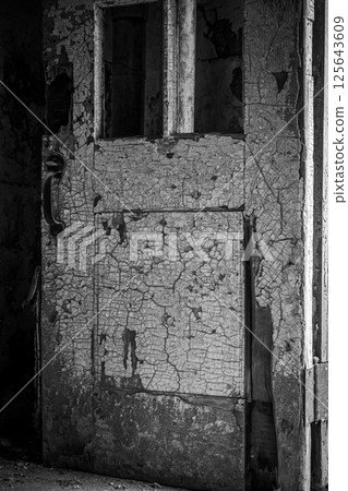 Chipped and peeling lead based paint on an old wall. Chipped and peeling lead based paint on an old wall. 125643609