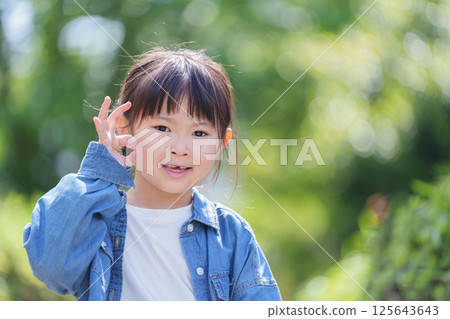 Smiling child saying OK 125643643