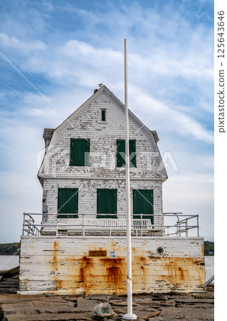 Rockland Breakwater Lighthouse cutting through the harbor on the Gulf of Maine Rockland Breakwater Lighthouse cutting through the harbor on the Gulf of Maine 125643646