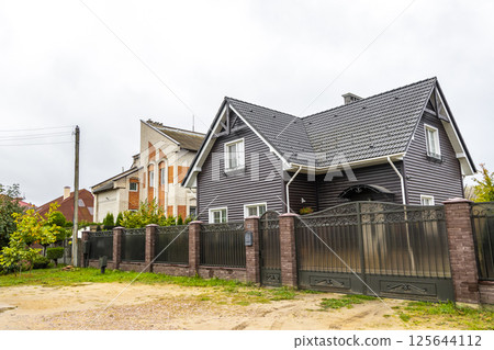 Brest Belarus colorful village streets with wooden huts brick houses . Brest Belarus colorful village streets with wooden huts brick houses . 125644112
