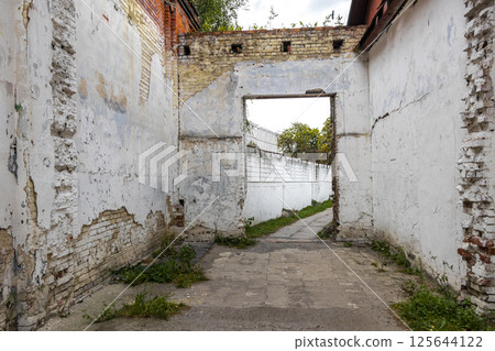 Broken abandoned burnt down industrial building hall house Brest Belarus. 125644122