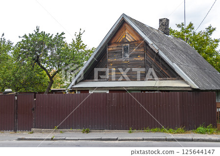 Brest Belarus colorful village streets with wooden huts brick houses . Brest Belarus colorful village streets with wooden huts brick houses . 125644147