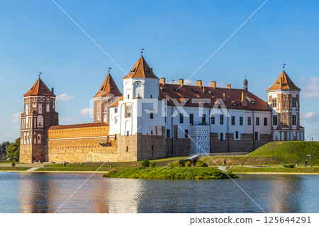 Mir Castle majestic fortification fortress Park monument with lake Belarus. 125644291