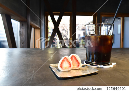 Iced coffee and strawberry daifuku dessert at a traditional Japanese cafe 125644601