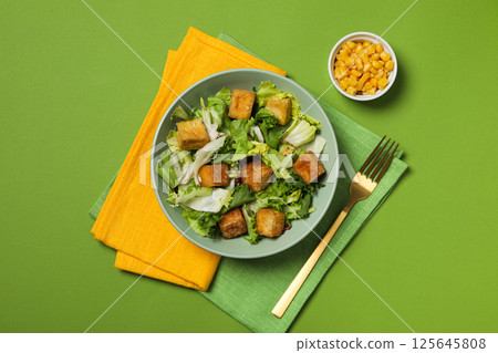 Fried tofu salad on a green background 125645808