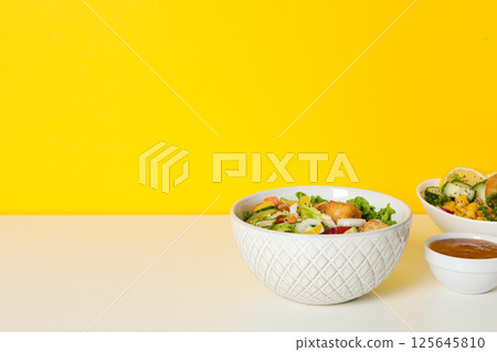 Fried tofu salad with sauce and vegetables Fried tofu salad with sauce and vegetables 125645810